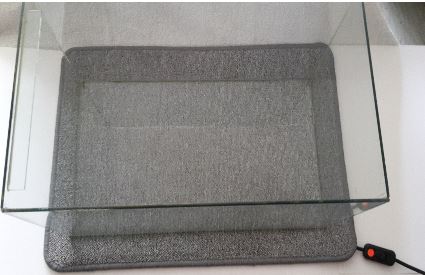 Aquarium oder Terrarium temperieren.